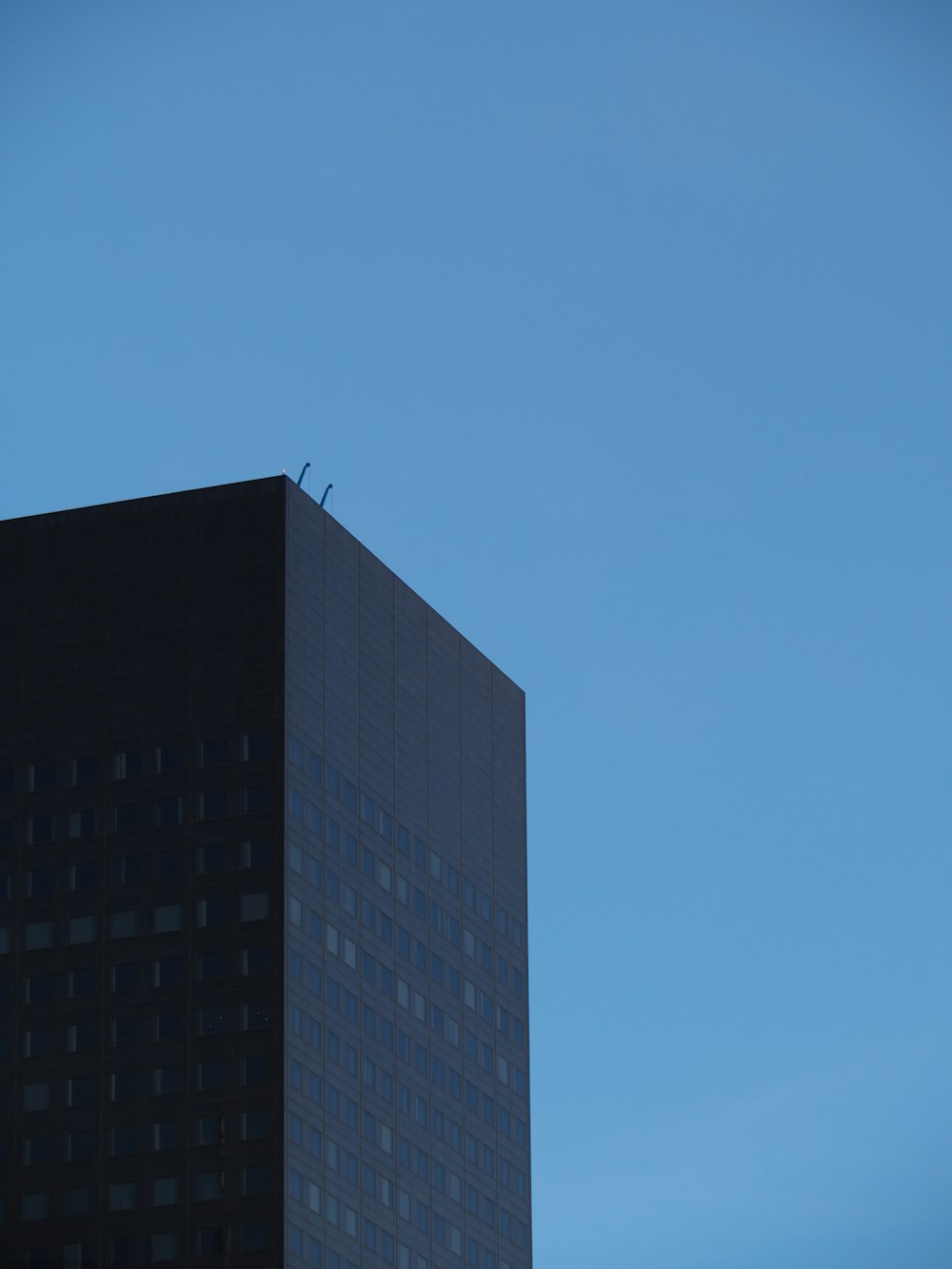 black concrete building under blue sky during daytime