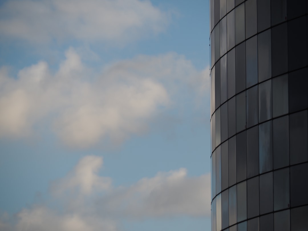 white and blue concrete building under blue sky during daytime