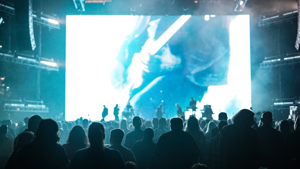 people standing on stage during nighttime