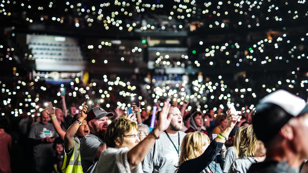 people gathering on a concert during night time