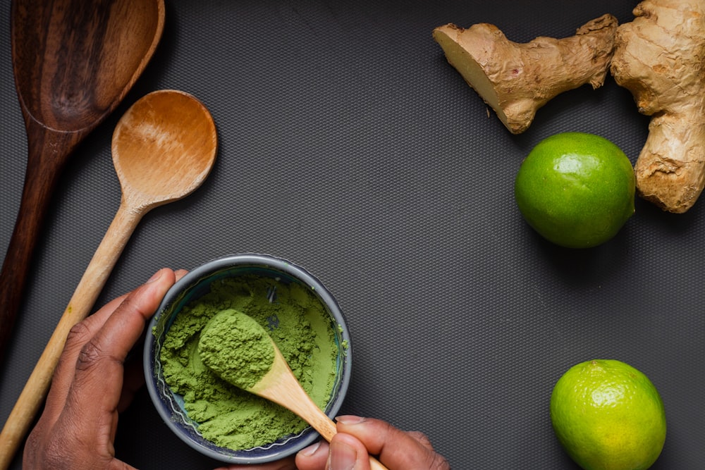 green liquid in stainless steel cup