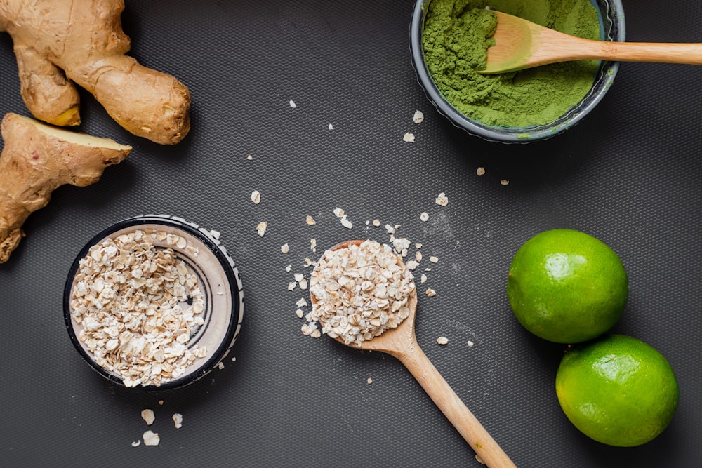 green apple beside brown wooden spoon