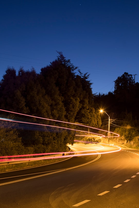 time lapse photography of cars on road during night time in Valdivia Chile