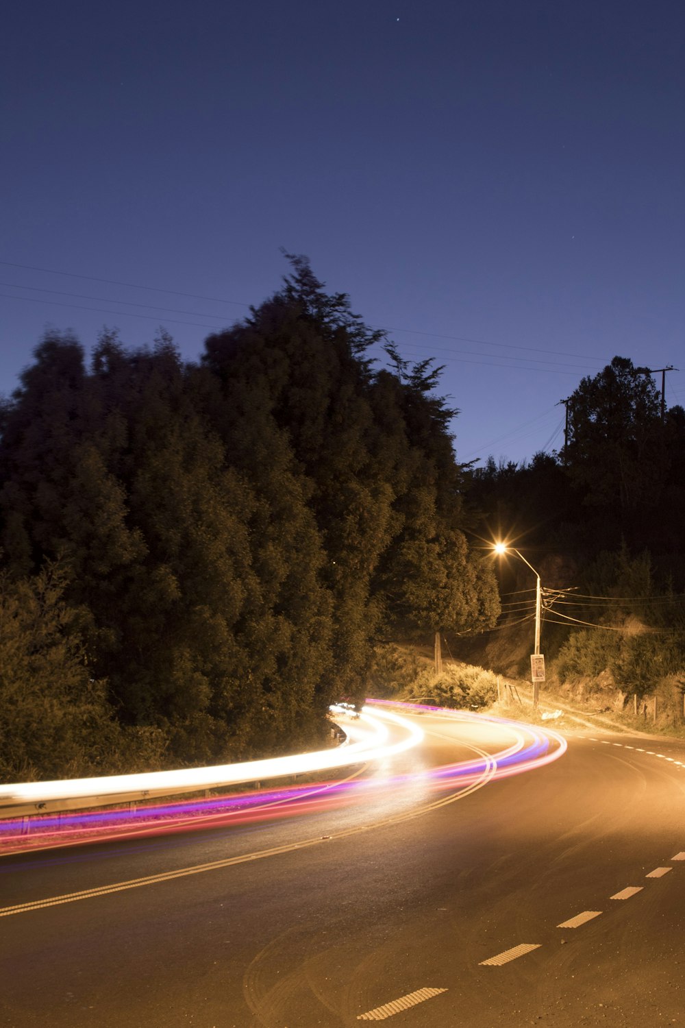 time lapse photography of cars on road during night time