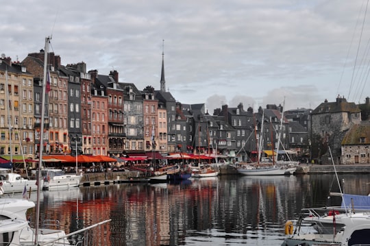 boat on water near buildings during daytime in Port of Honfleur France