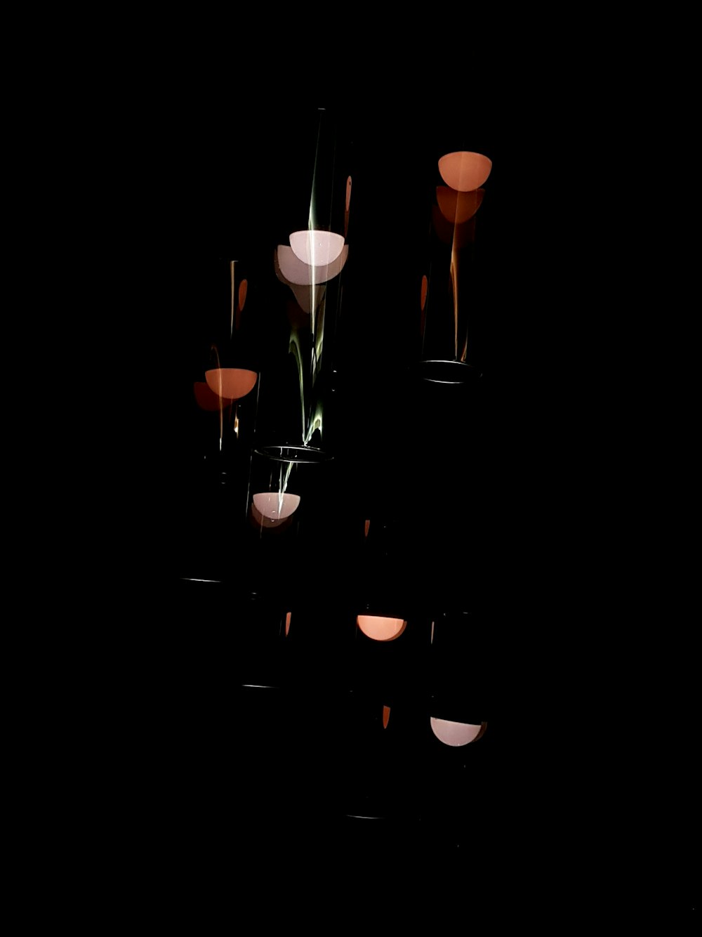 lighted candles on black surface