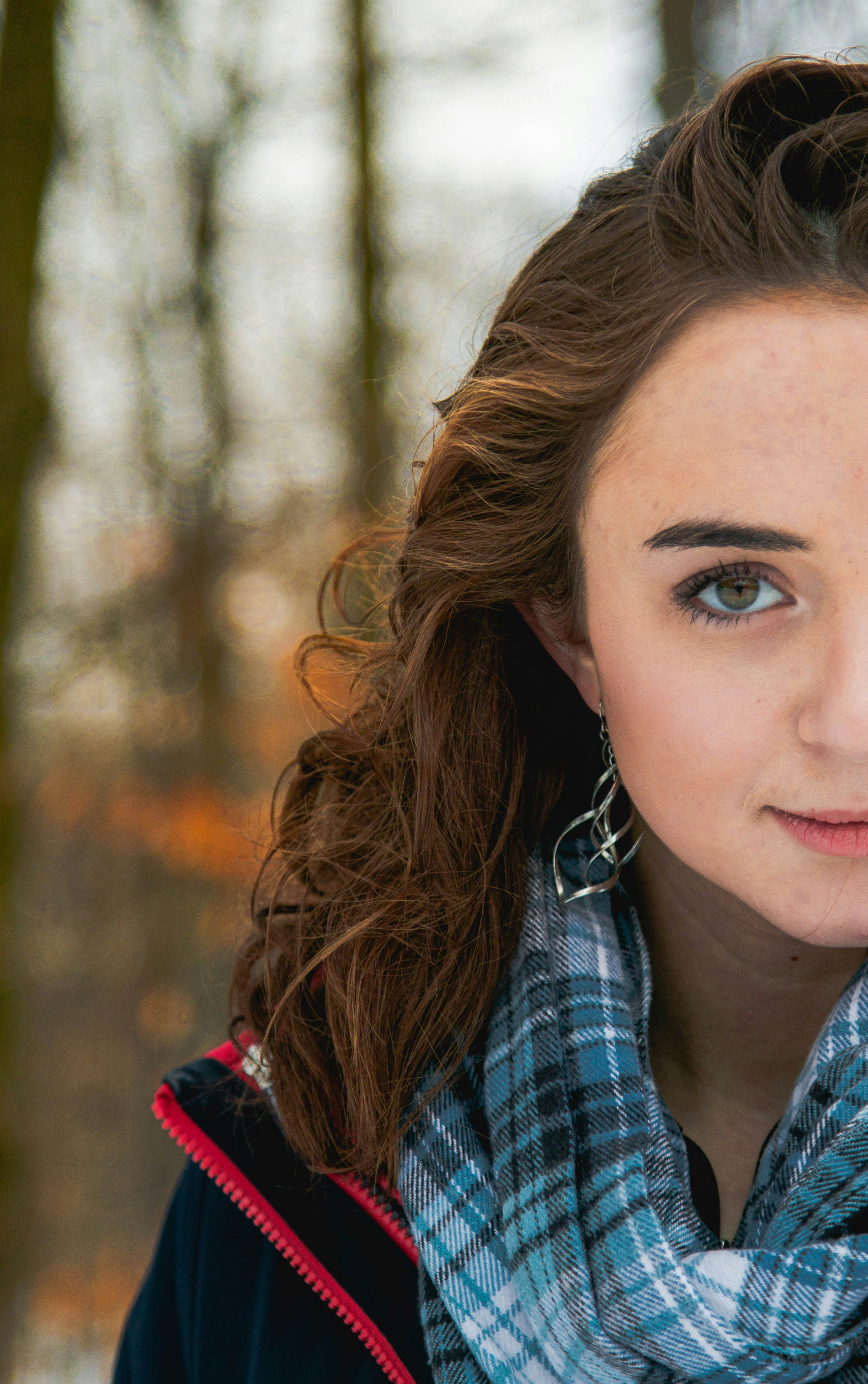 woman in blue and white plaid shirt