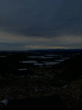 A sweeping landscape shot at dusk, highlighting vastness and mystery.
