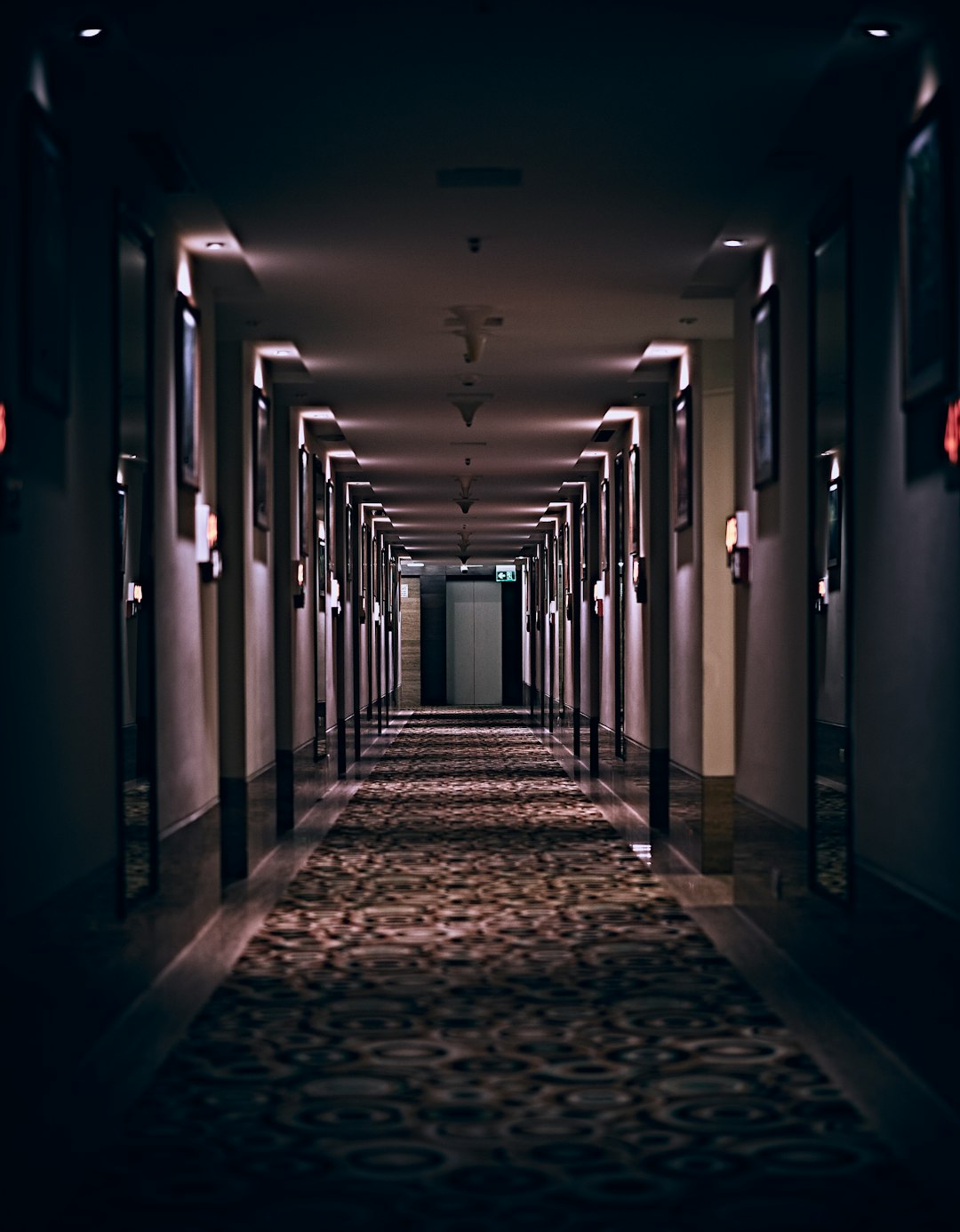 hallway with lights turned on in a hallway