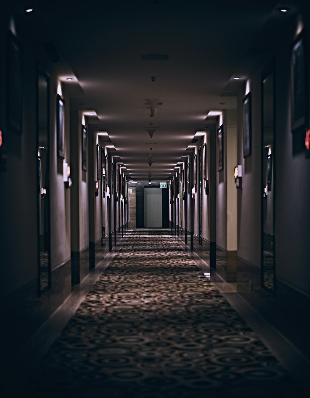 hallway with lights turned on in a hallway