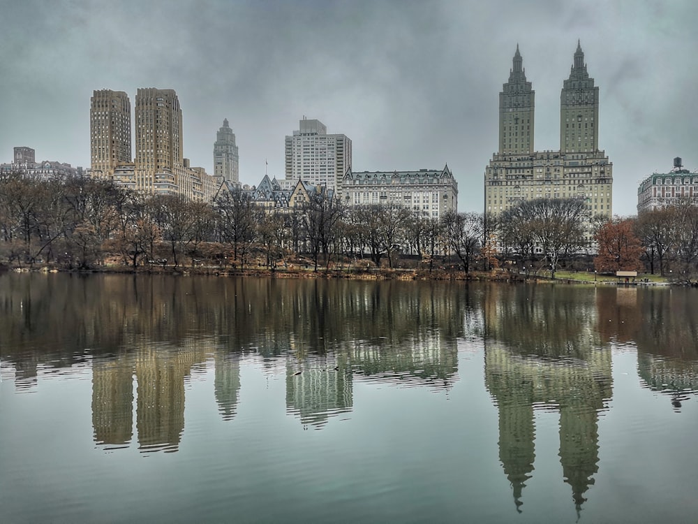 city skyline across body of water during daytime