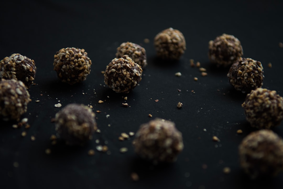 brown round fruits on black surface