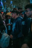 A group of people wearing matching hoodies at an event.