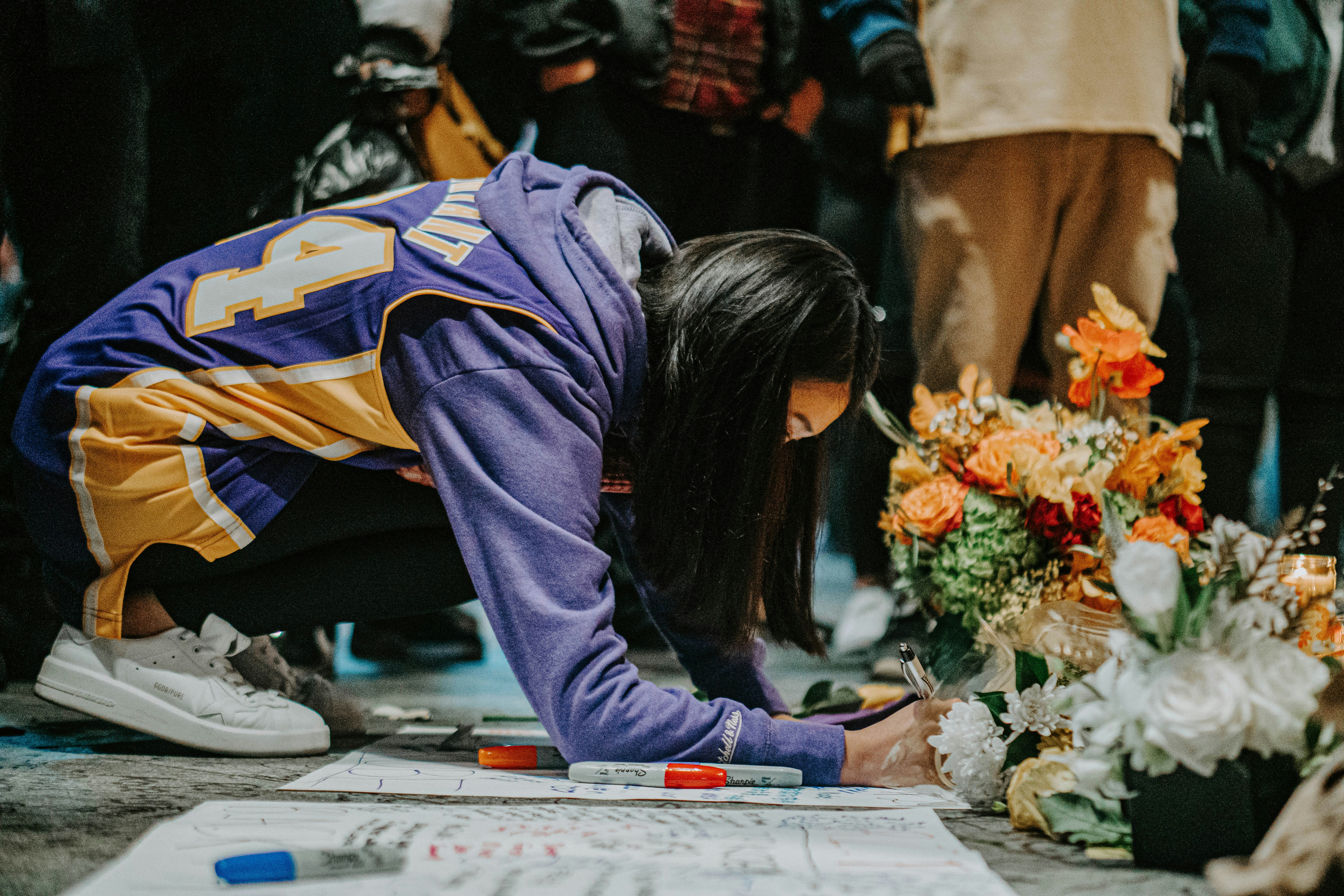 Fan's mourn Kobe Bryant's death at a vigil at Staples Center on January 26th, 2020.