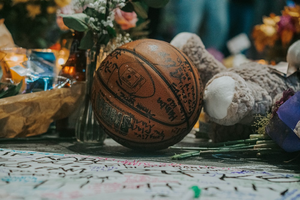 brown basketball on white and green table