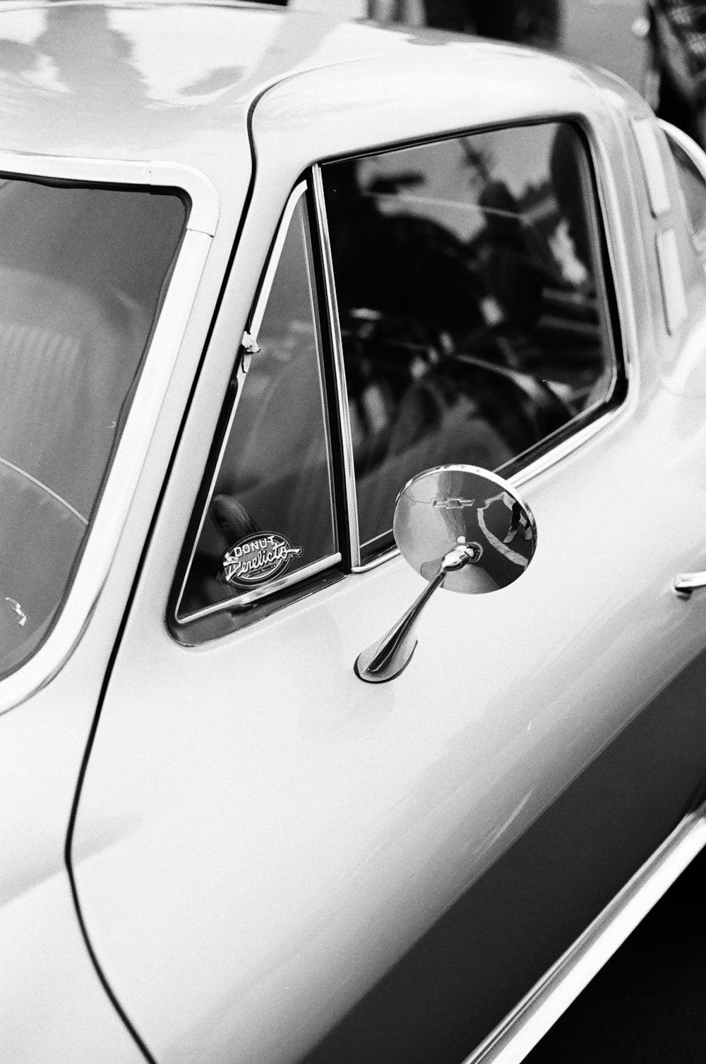 grayscale photo of car door