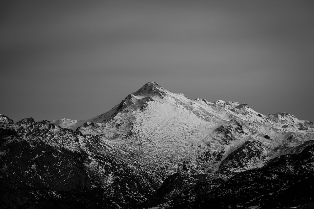 grayscale photo of snow covered mountain