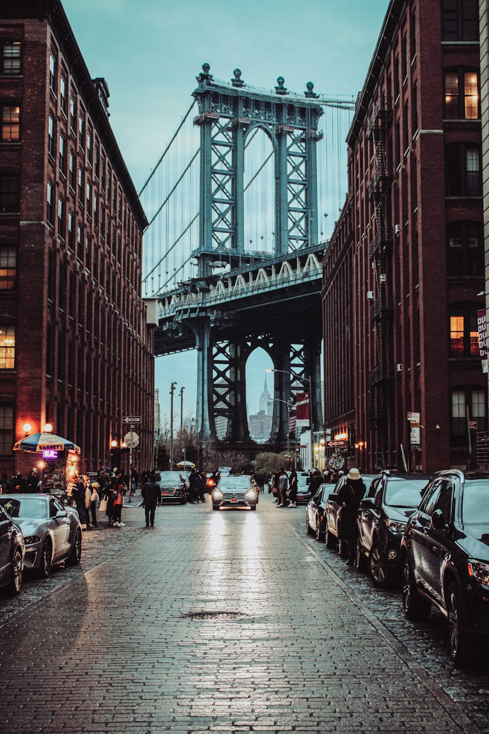 people walking on street near bridge during daytime