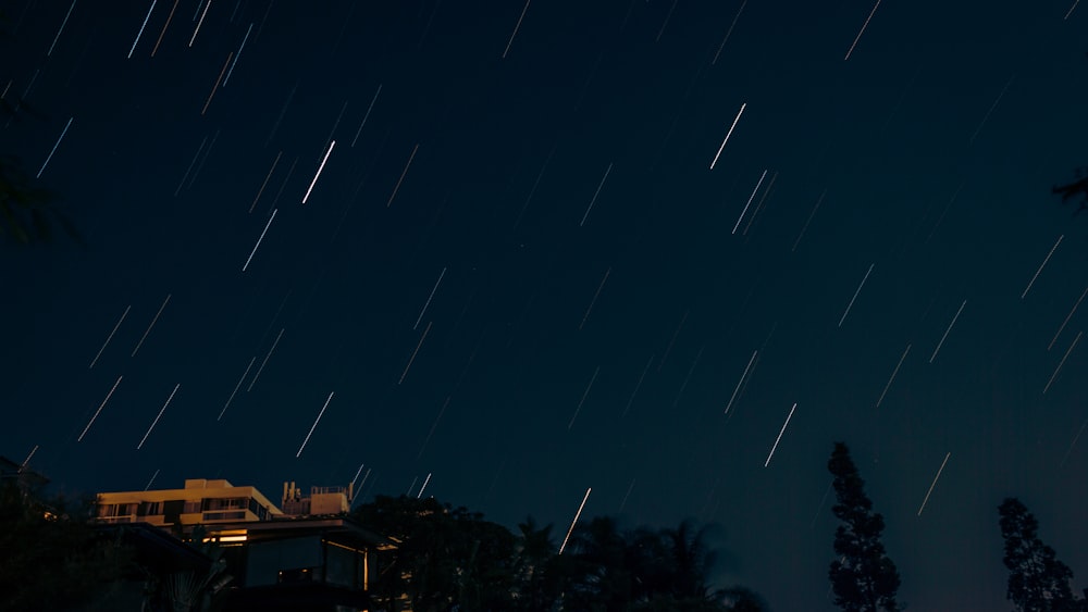 brown wooden house under blue sky during night time