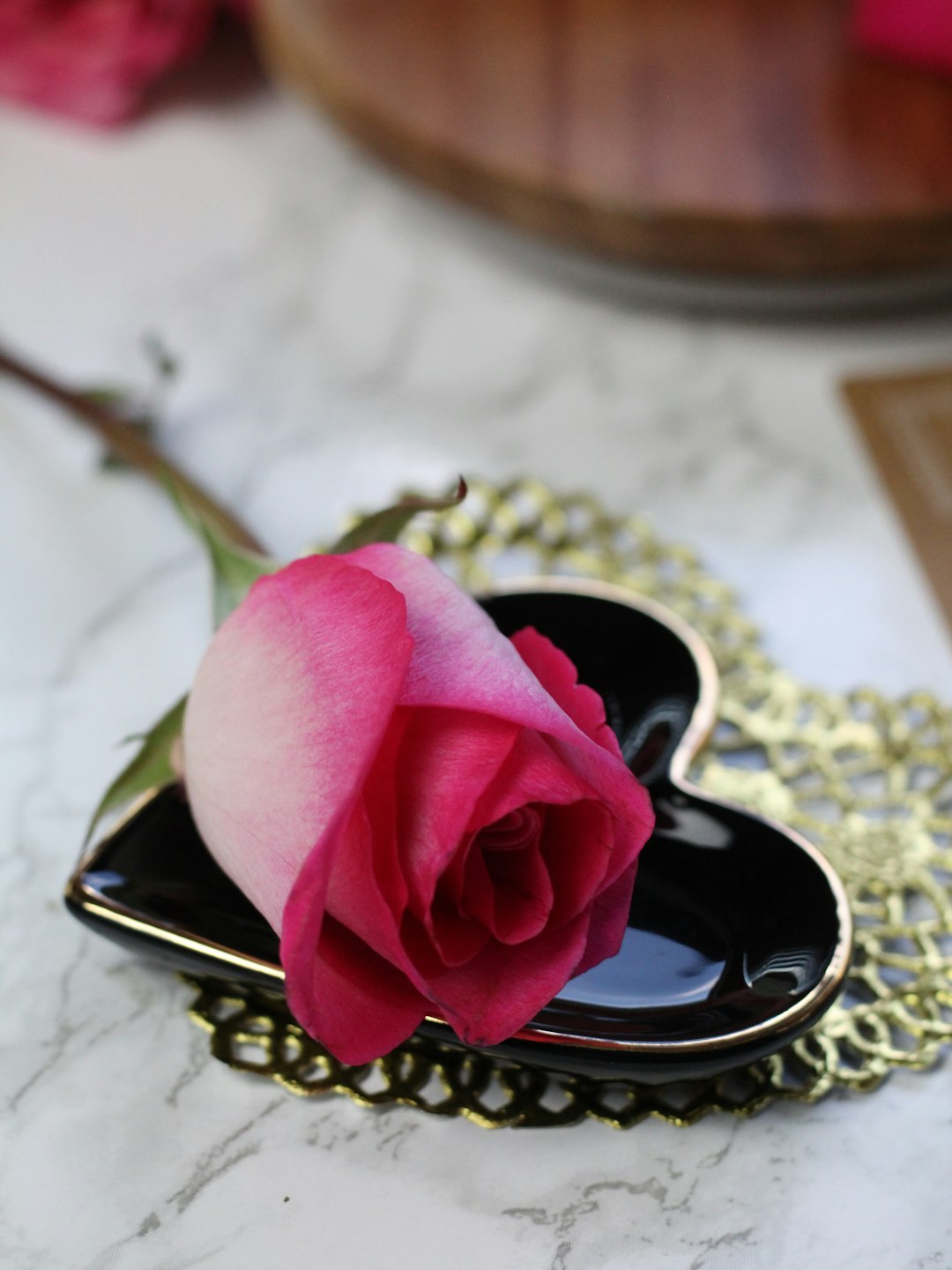 pink rose on gold ring