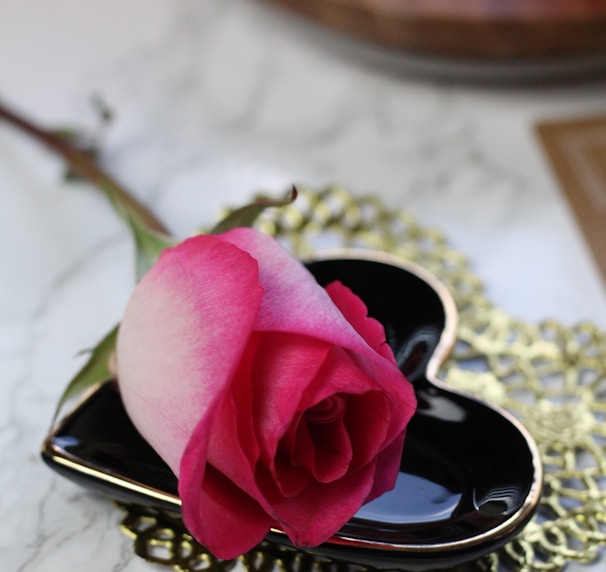 pink rose on gold ring