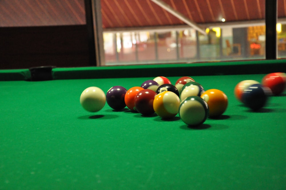 billiard balls on billiard table