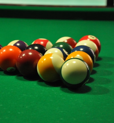 billiard balls on billiard table