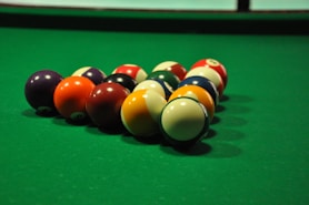 billiard balls on billiard table