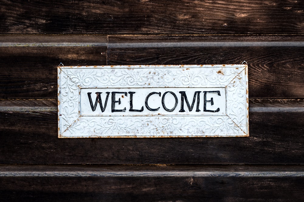 black and white wooden welcome signage