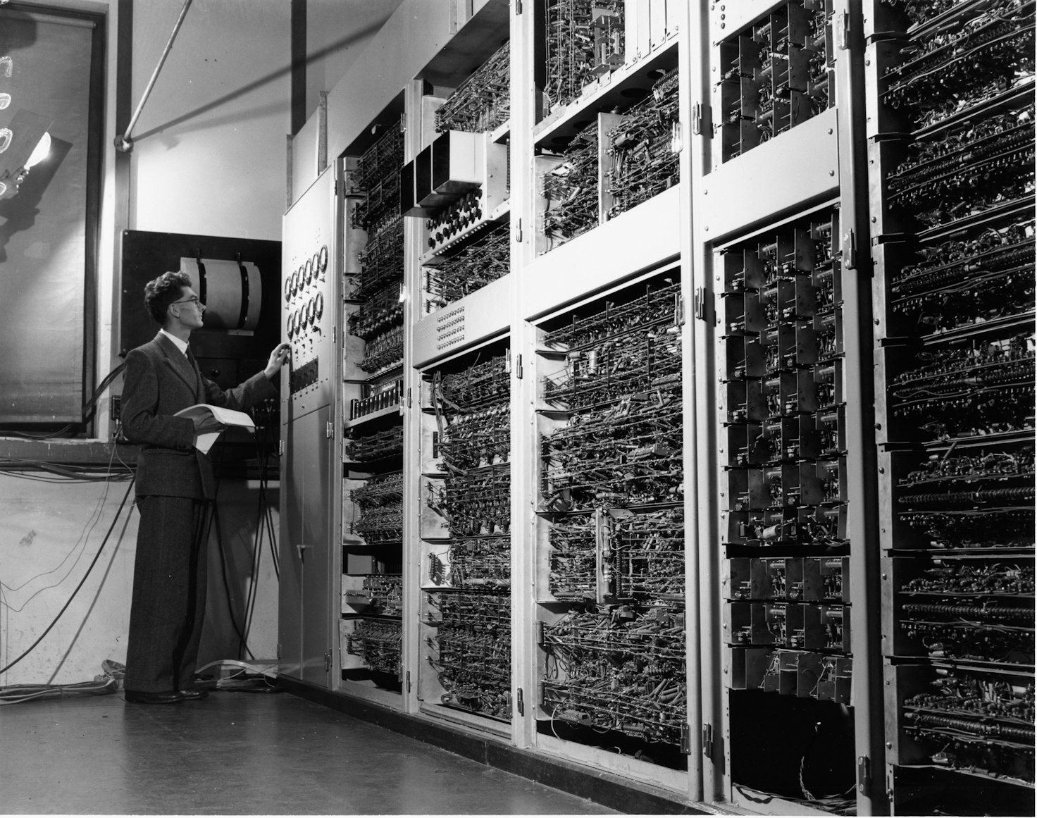 A person standing and checking out the data center.