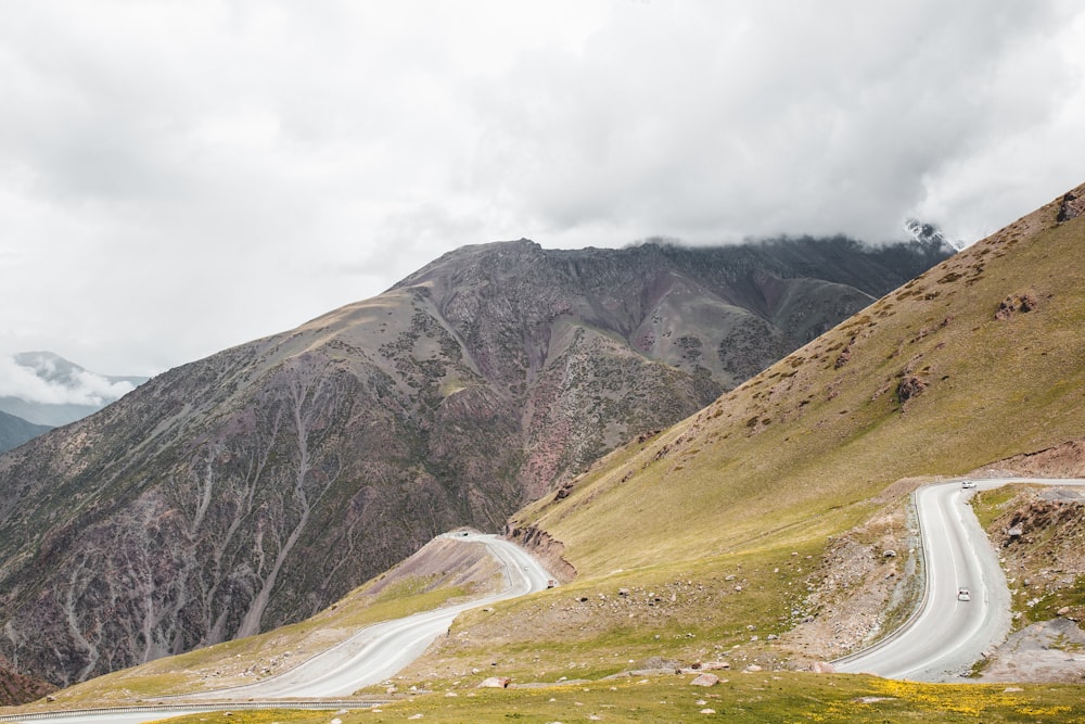 green and brown mountain under white clouds during daytime