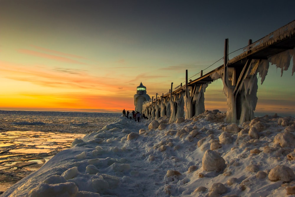 brown wooden dock on sea during daytime