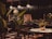 A dimly lit restaurant interior featuring large leafy plants and a wooden table set for dining. The ambiance is warm with copper pendant lights hanging above, casting a soft glow. Dark walls and flooring contribute to a cozy, intimate atmosphere.