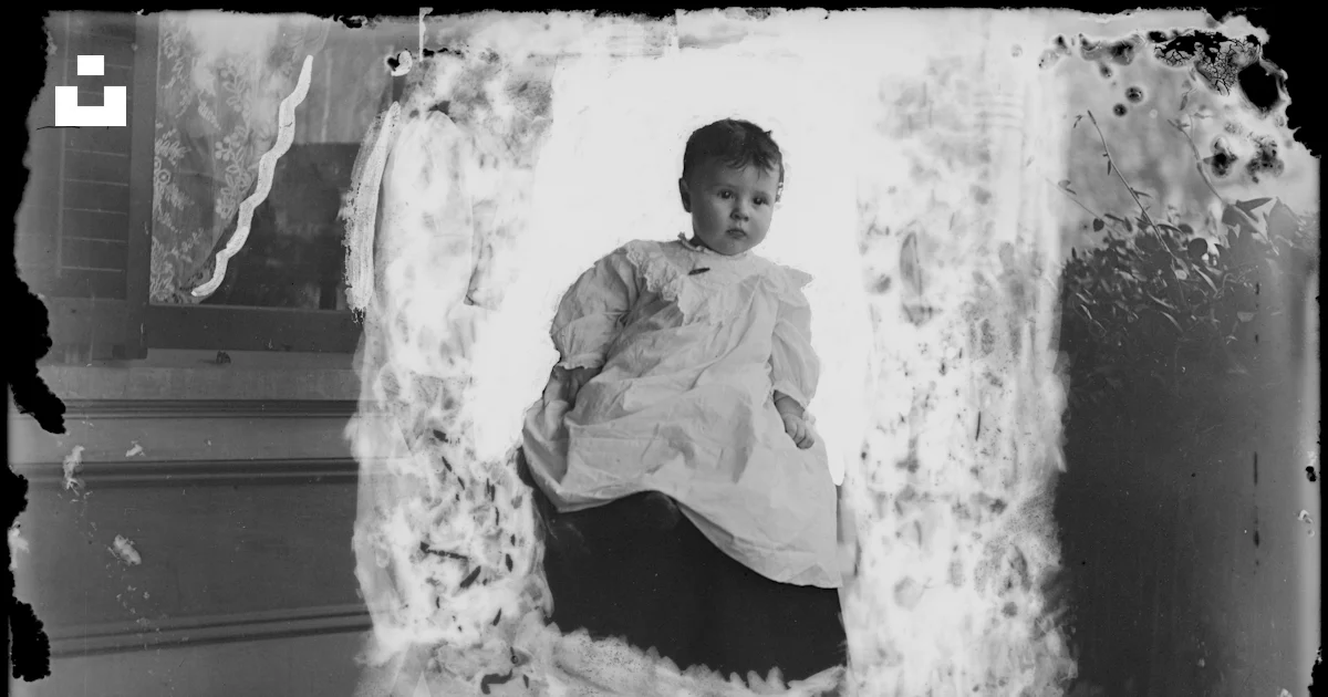 Grayscale Photo Of Boy In Dress Shirt Sitting On Floor Photo Free grayscale-photo-of-boy-in-dress-shirt-sitting-on-floor-photo-free
