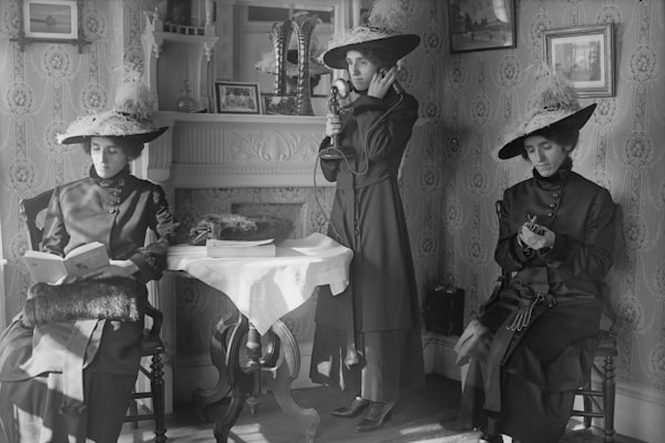 women sitting on chairs