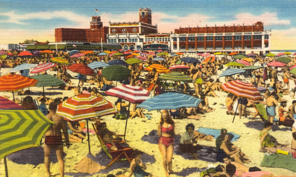 people on beach with umbrella painting