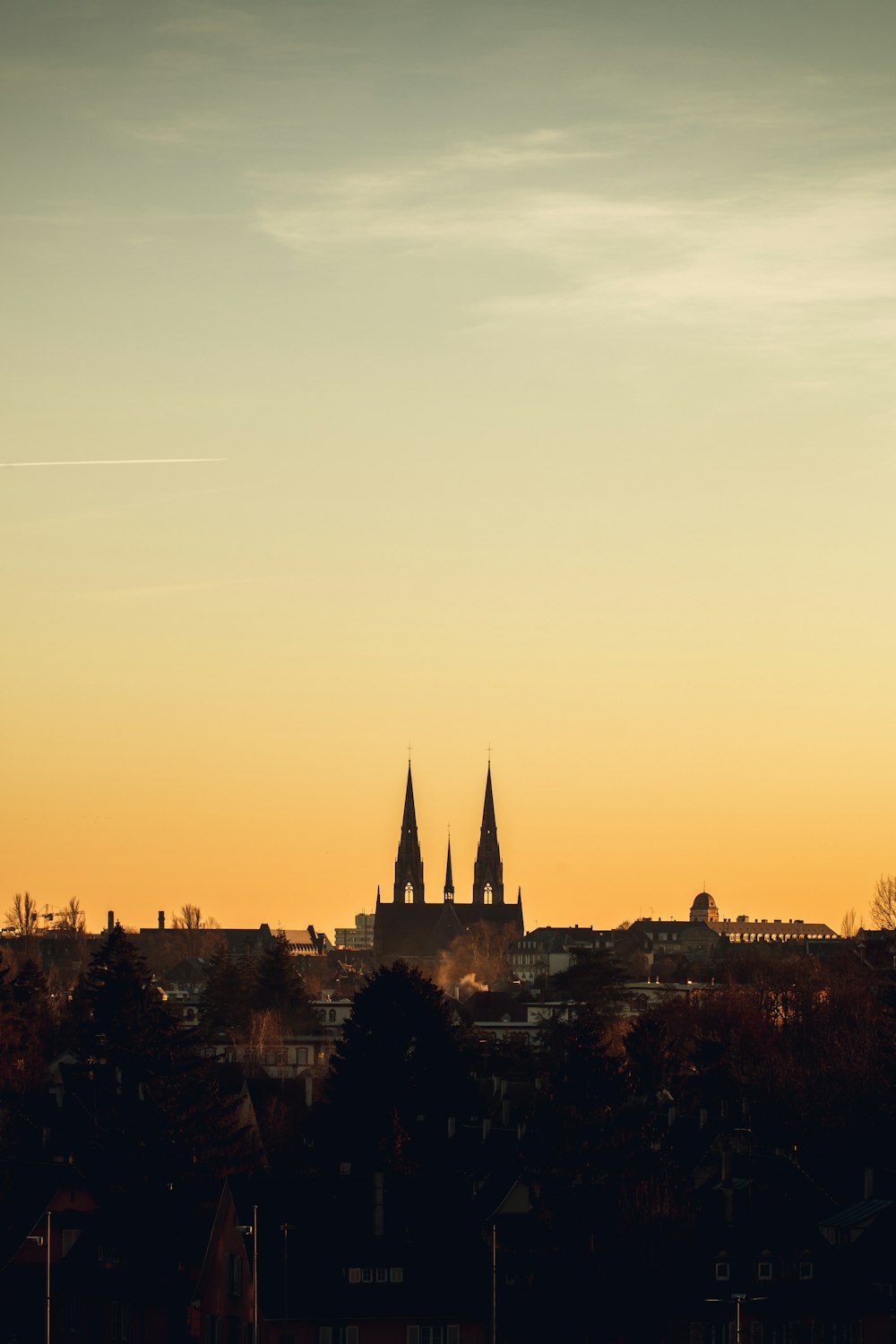 silhouette of building during sunset