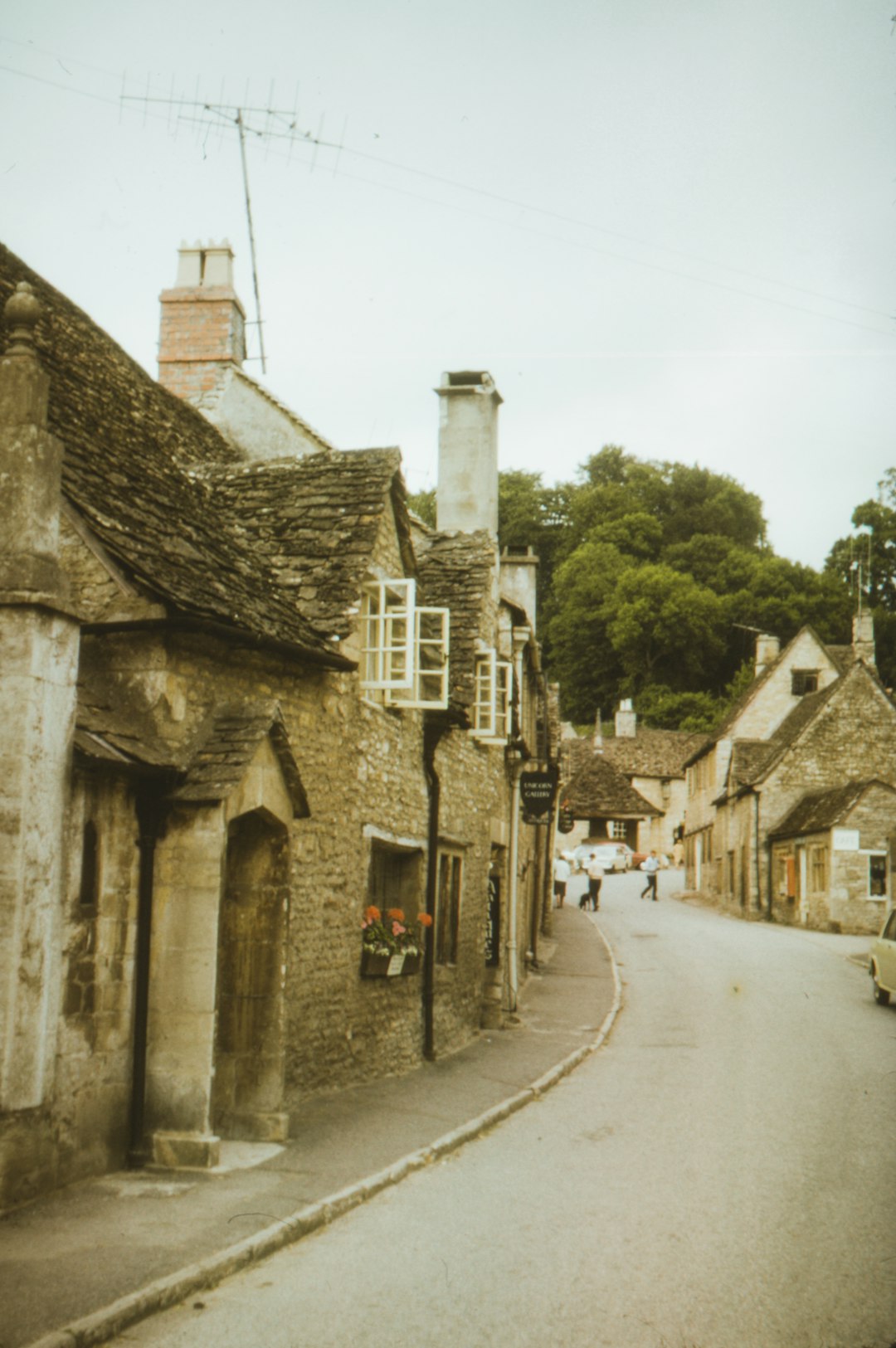 gray concrete houses beside road during daytime