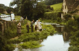 A group of families participating in a fun outdoor activity by the water.