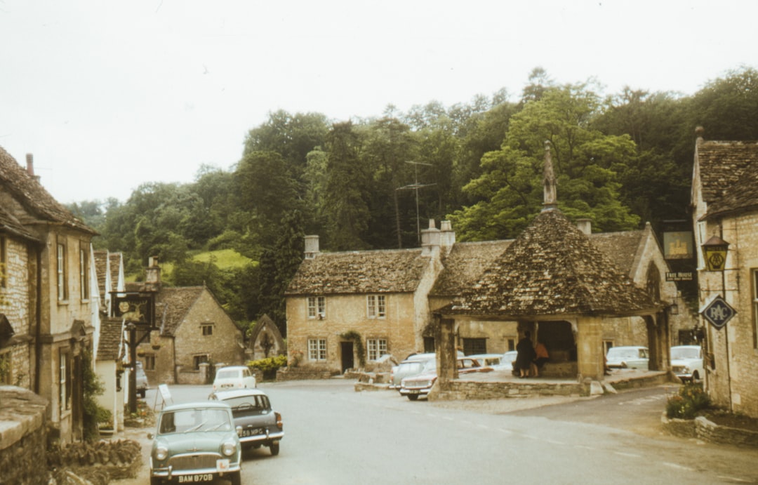 1965 view of the high street of movie location Castle Combe Village in the Cotswolds, Wiltshire, UK -  Photo by Annie Spratt | Castle Combe England