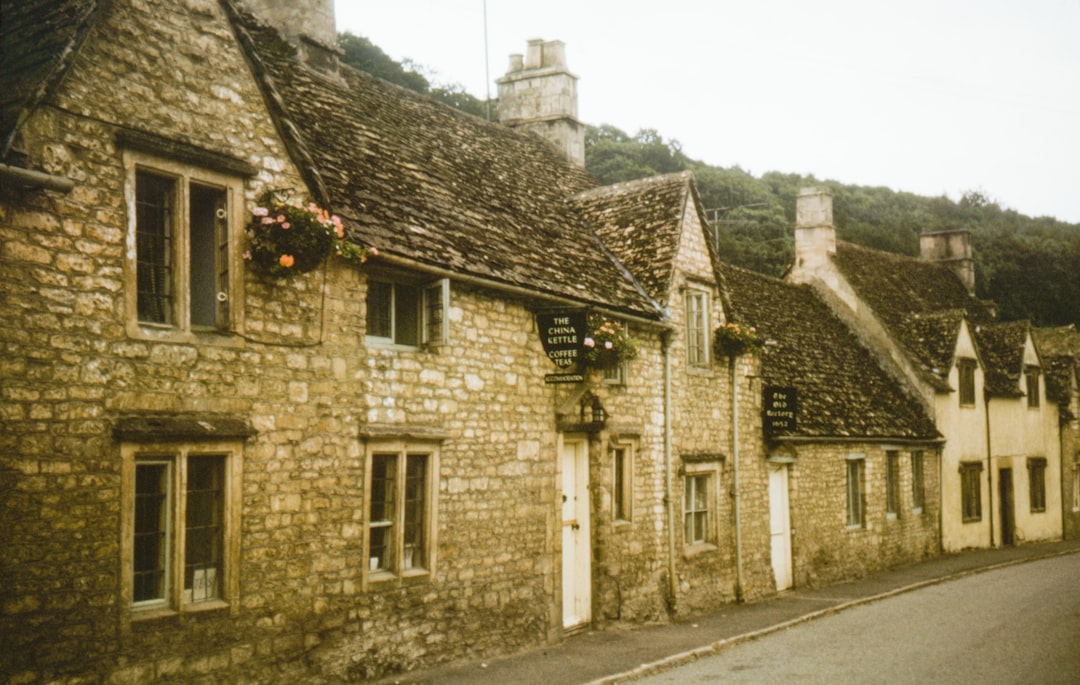 Cotswolds cottages with white doors in 1956 in Castle Combe Village, Wiltshire, UK – Doctor Dolittle film location - Photo by Annie Spratt | Castle Combe England