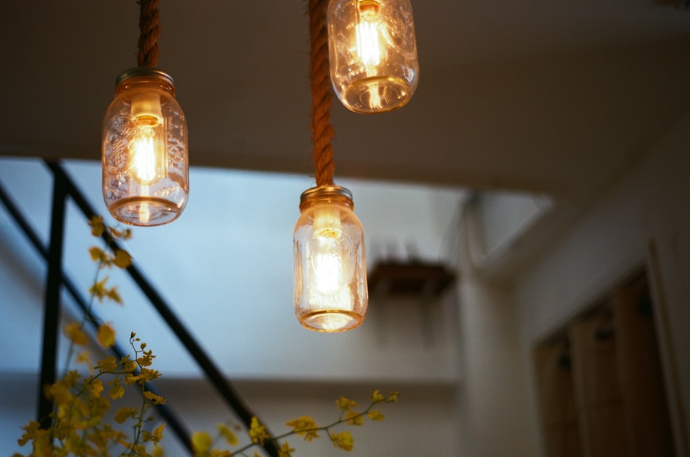 yellow pendant lamp turned on in room