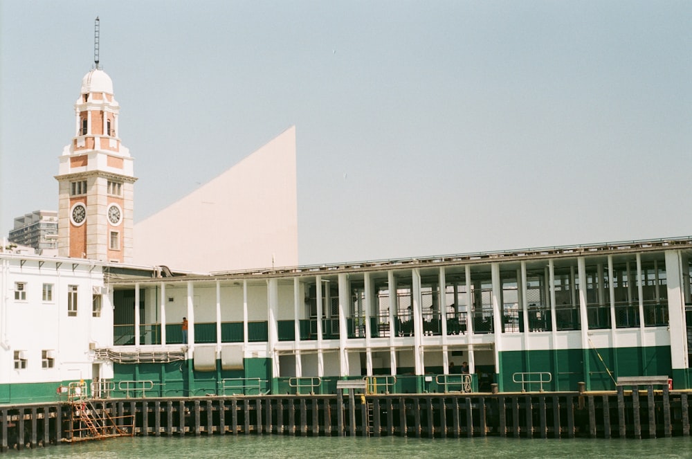 white and green concrete building under blue sky during daytime