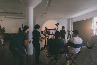 people sitting on chairs in front of table