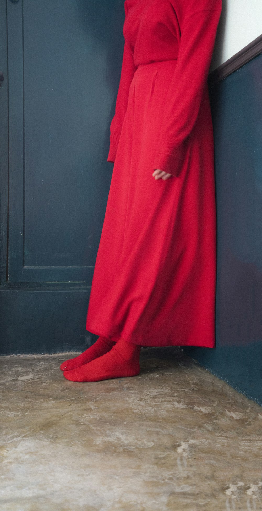 red long sleeve dress on brown wooden door