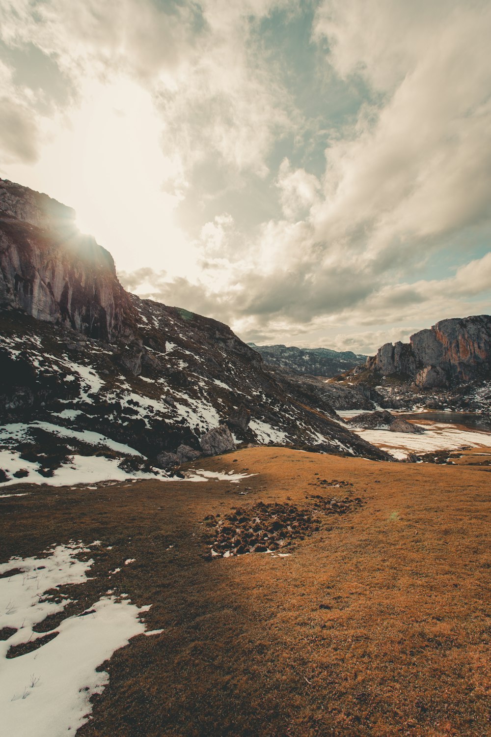 brown and gray rocky mountain under white cloudy sky during daytime