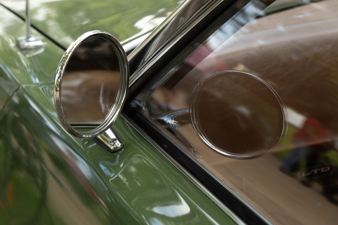 green car with brown framed sunglasses