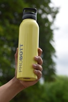 yellow and white plastic bottle
