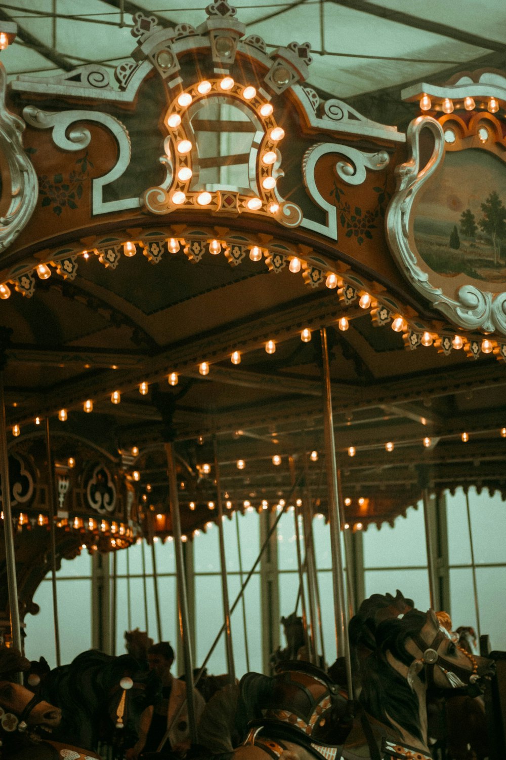 white and brown carousel with people