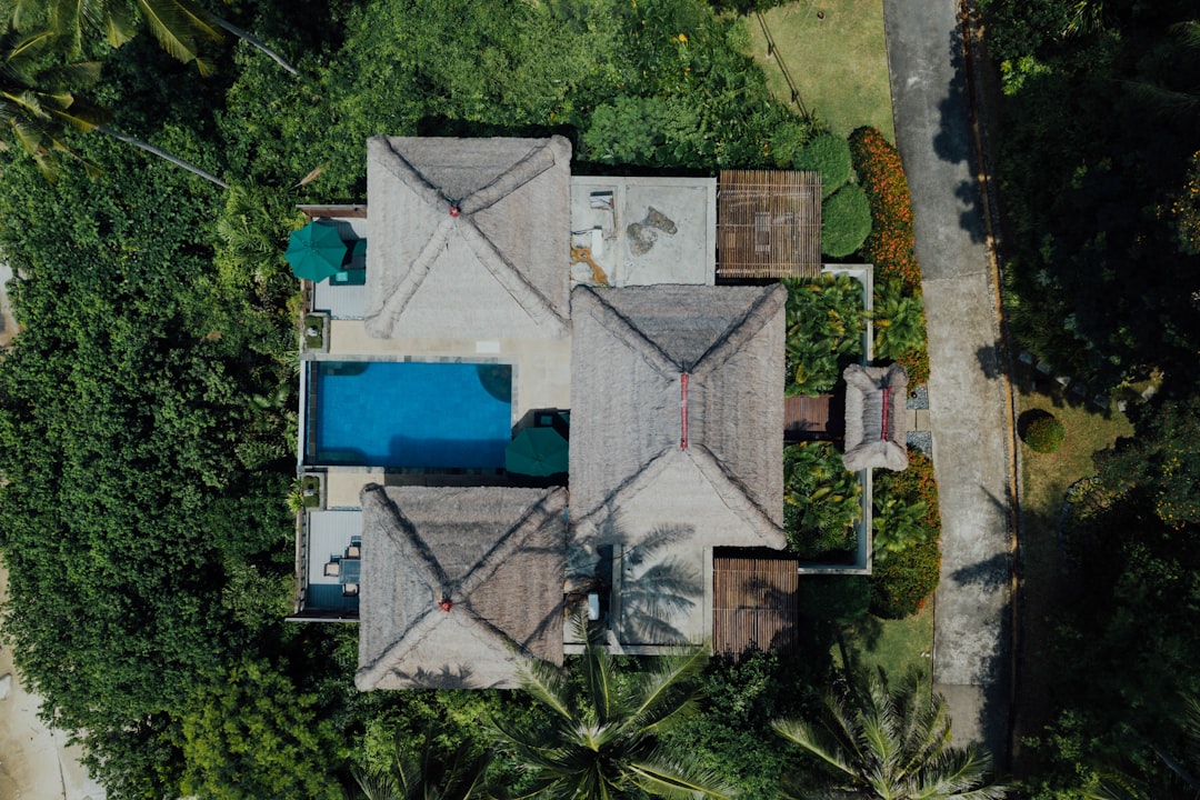 aerial view of white and blue house